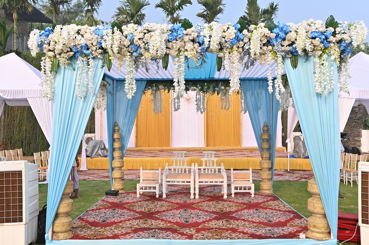 Mandap designed with beautiful blue coloured theme flowers for a traditional event.