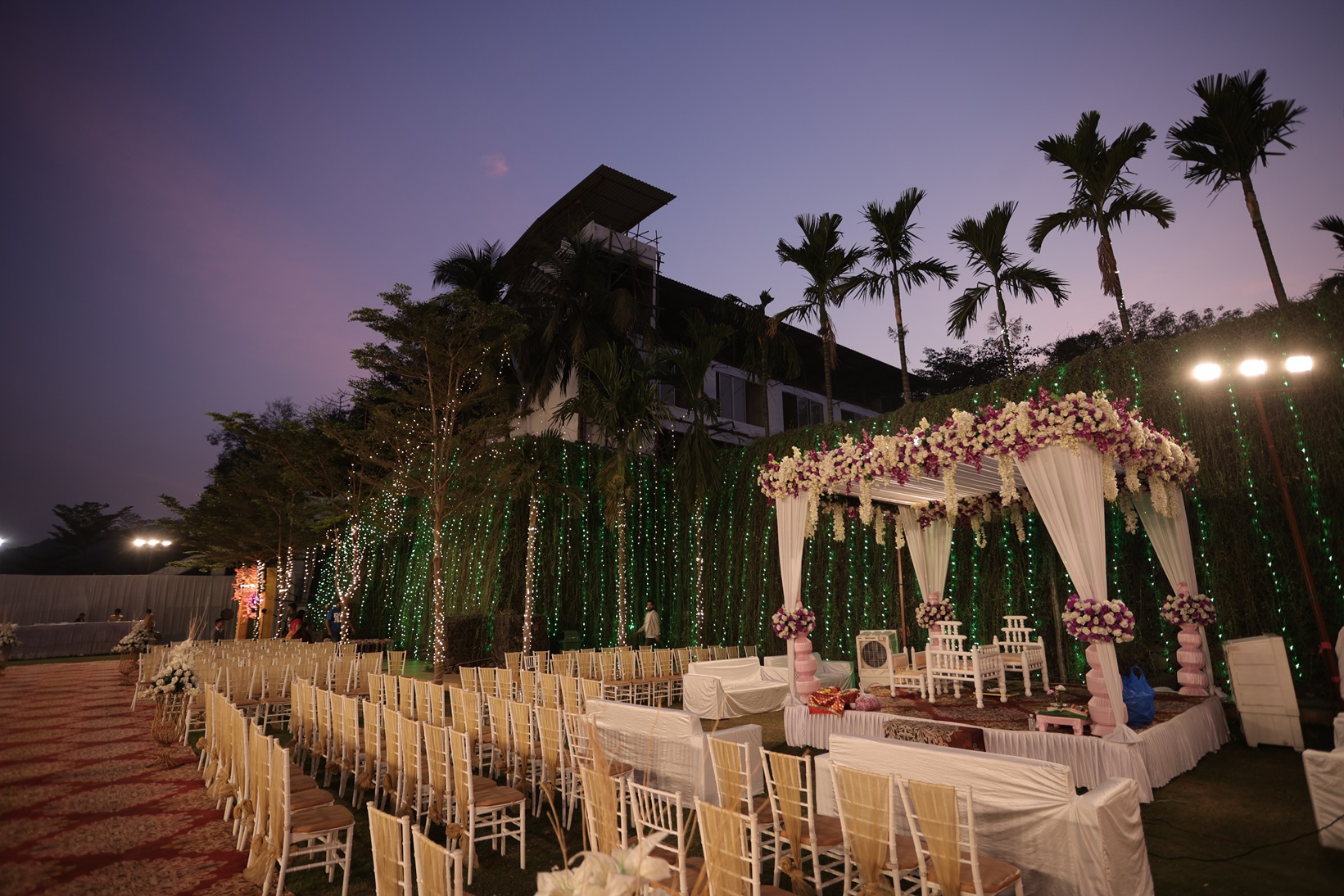 Decorated mandap featuring soft pastel flowers. 